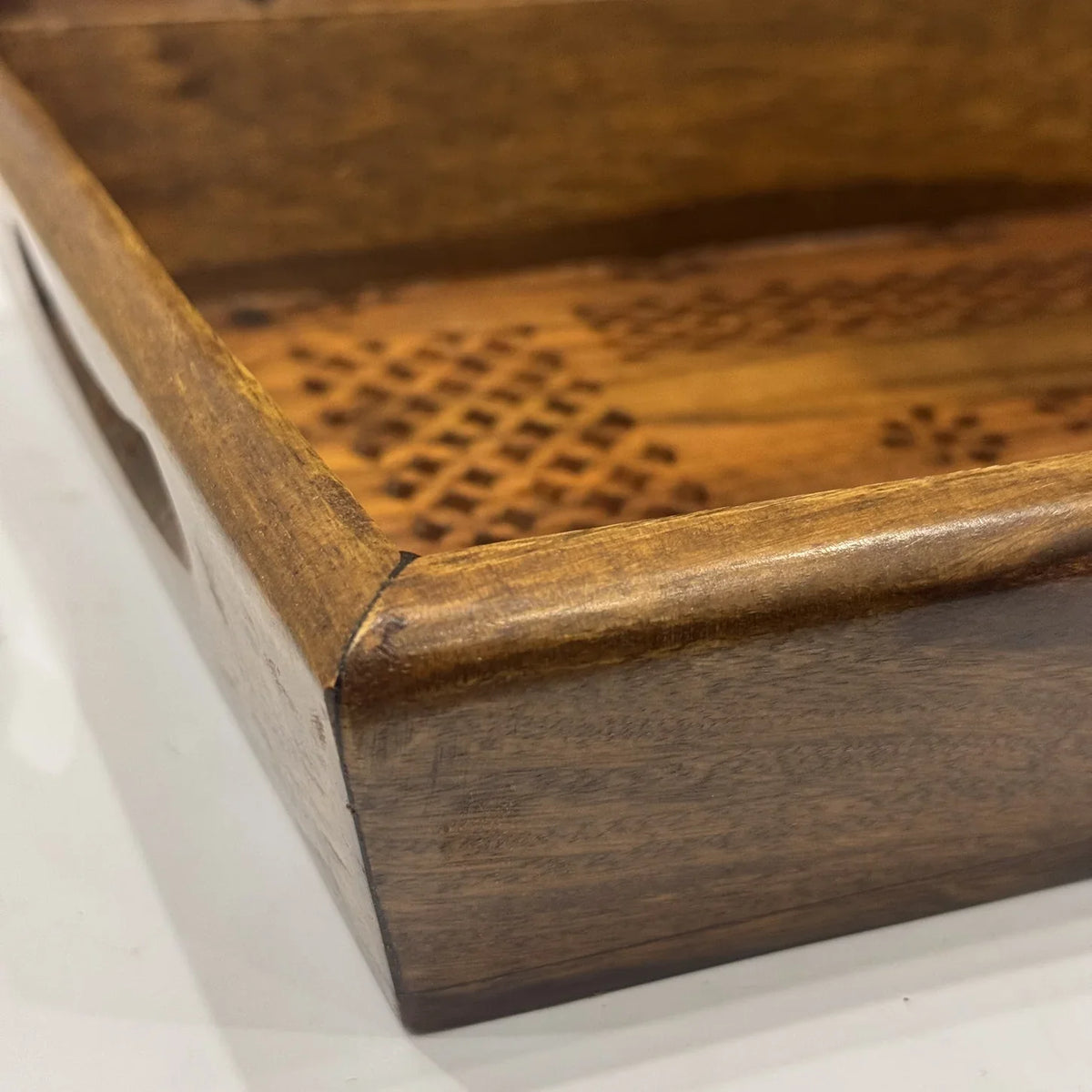 Carved through wooden serving tray with cutout side handles, handmade in Lahore by Craft Edges