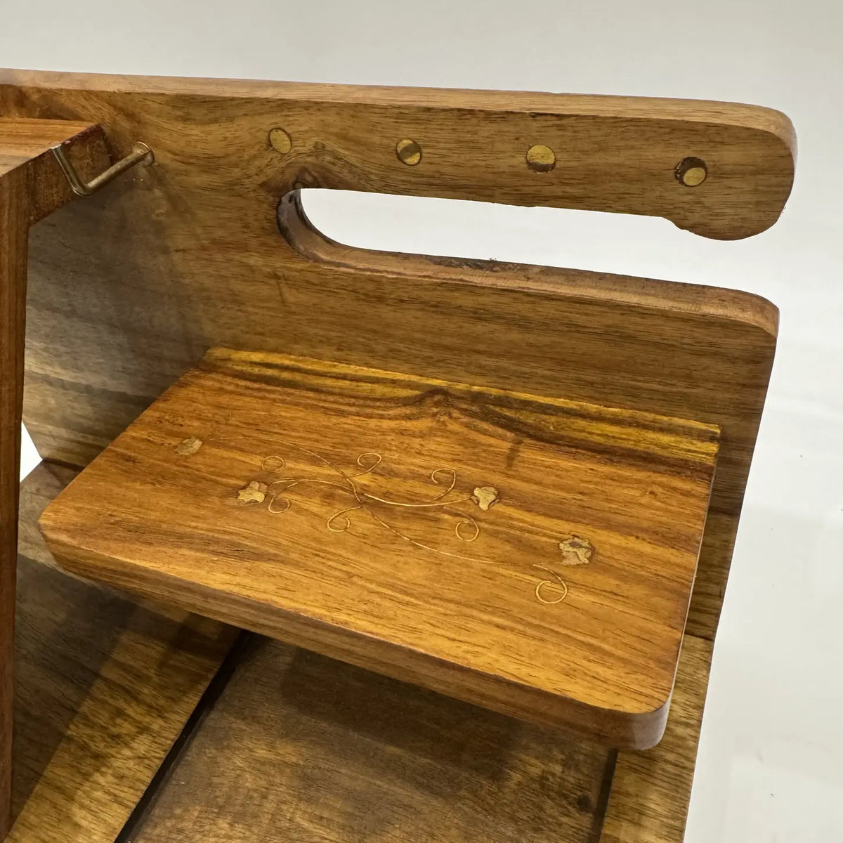 Close-up of the wooden desk organizer shelf with brass inlay, key hook and watch rail