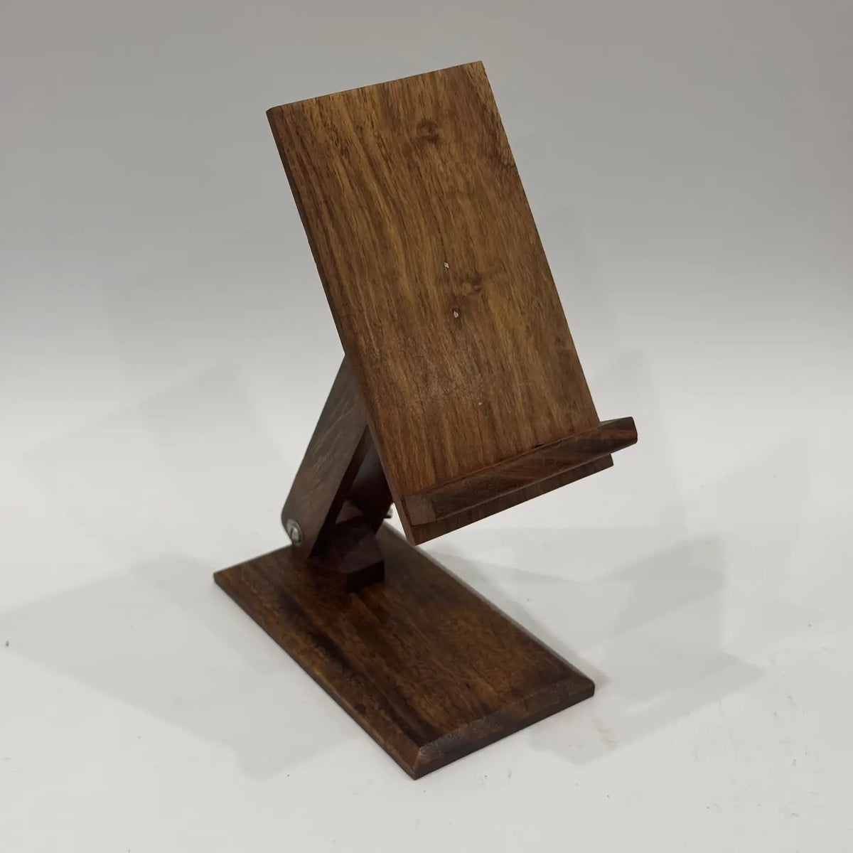 Plain wooden mobile holder stand with adjustable arm, front angle view on white background