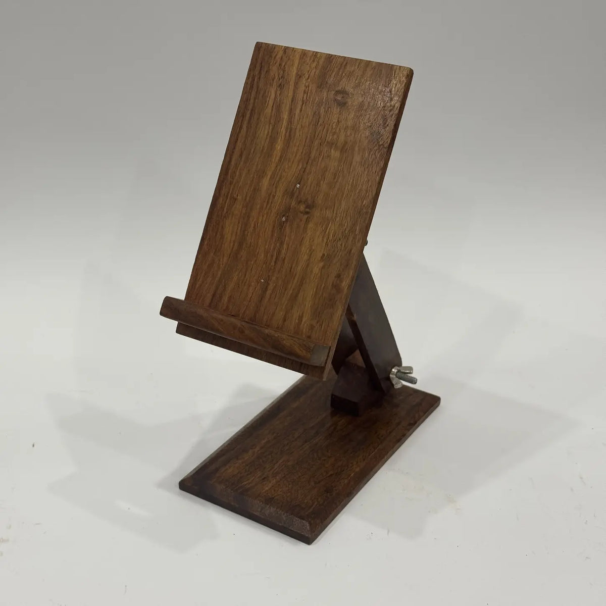 Plain sheesham wood phone stand side view showing adjustable arm and metal wing nut