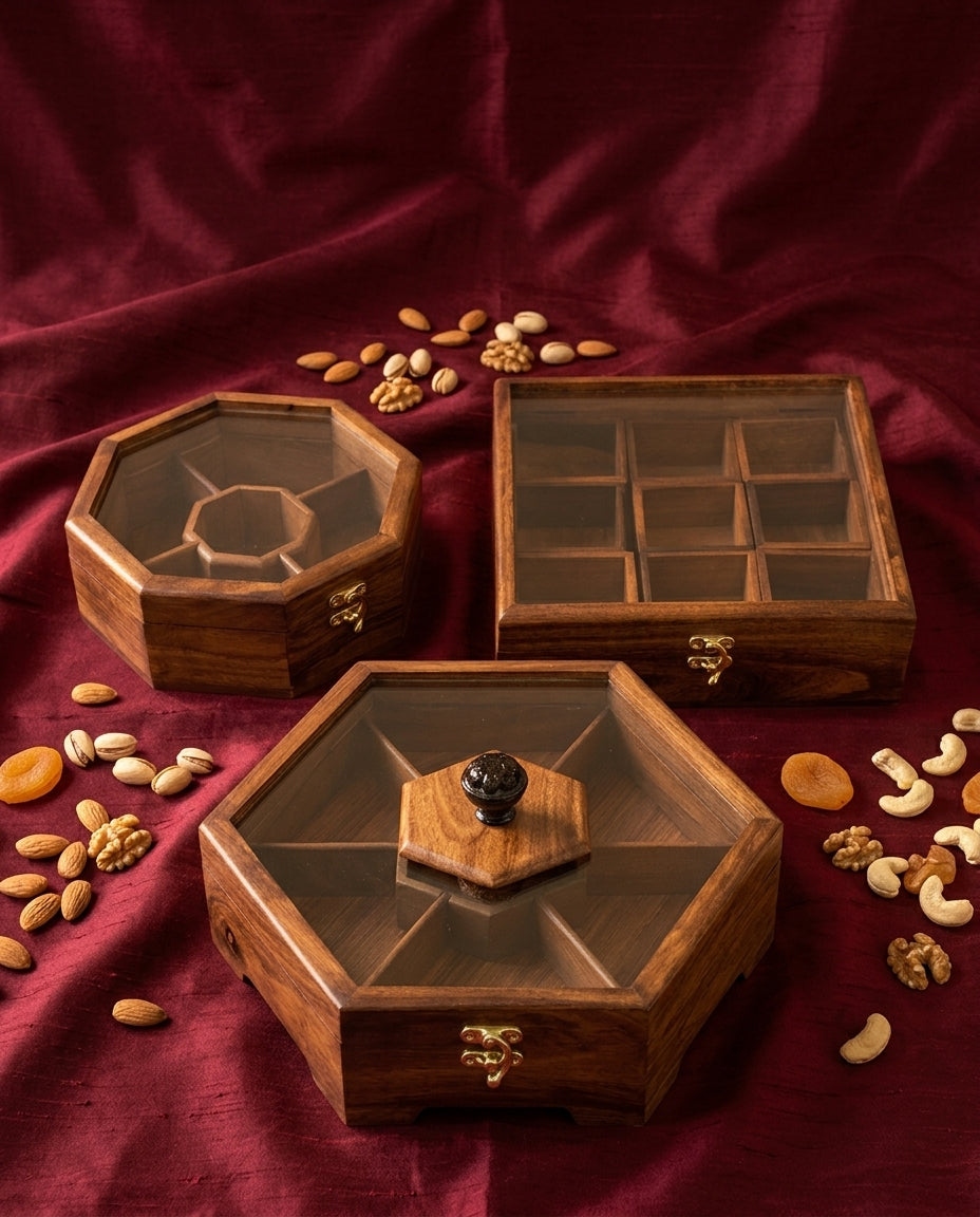 Wooden dry fruit box set of 3 styled as a wedding gift on maroon silk with almonds, pistachios and walnuts